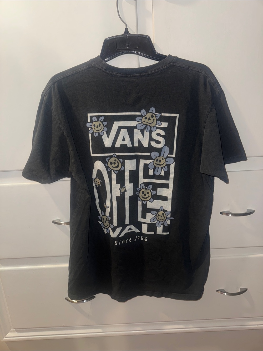 Vans Black Graphic Tee with White Logo and Smiling Flower Accents